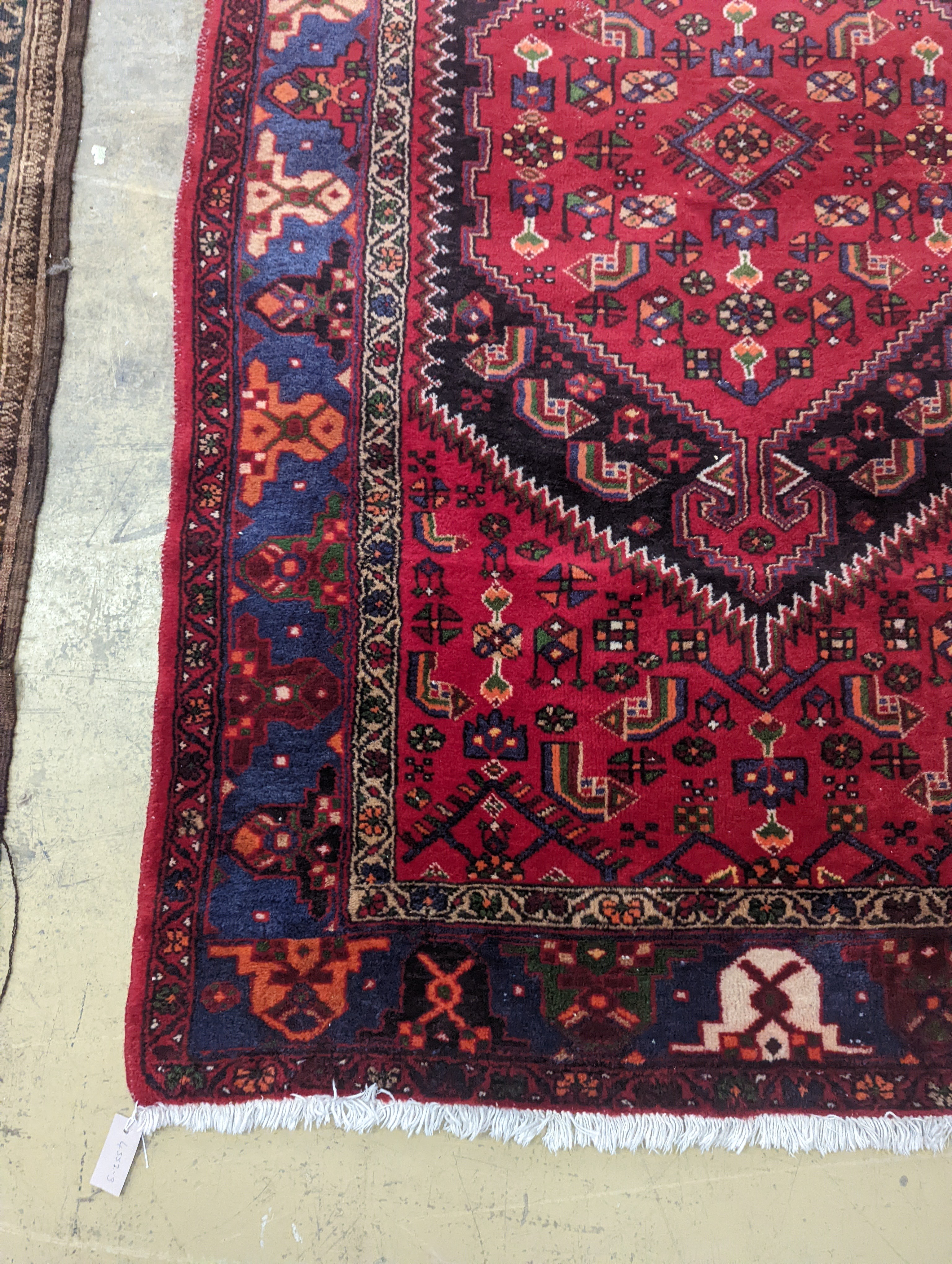 A Hamadan red ground rug, 220 x 130cm